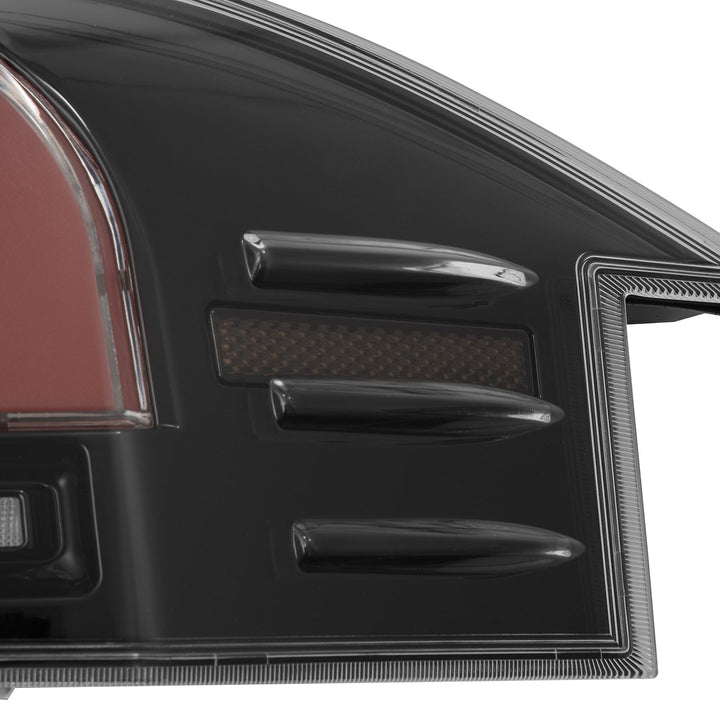 12-21 Tesla Model S LUXX-Series LED Tail Lights Black Red (With Black Trunk Center Piece Replacement) | AlphaRex